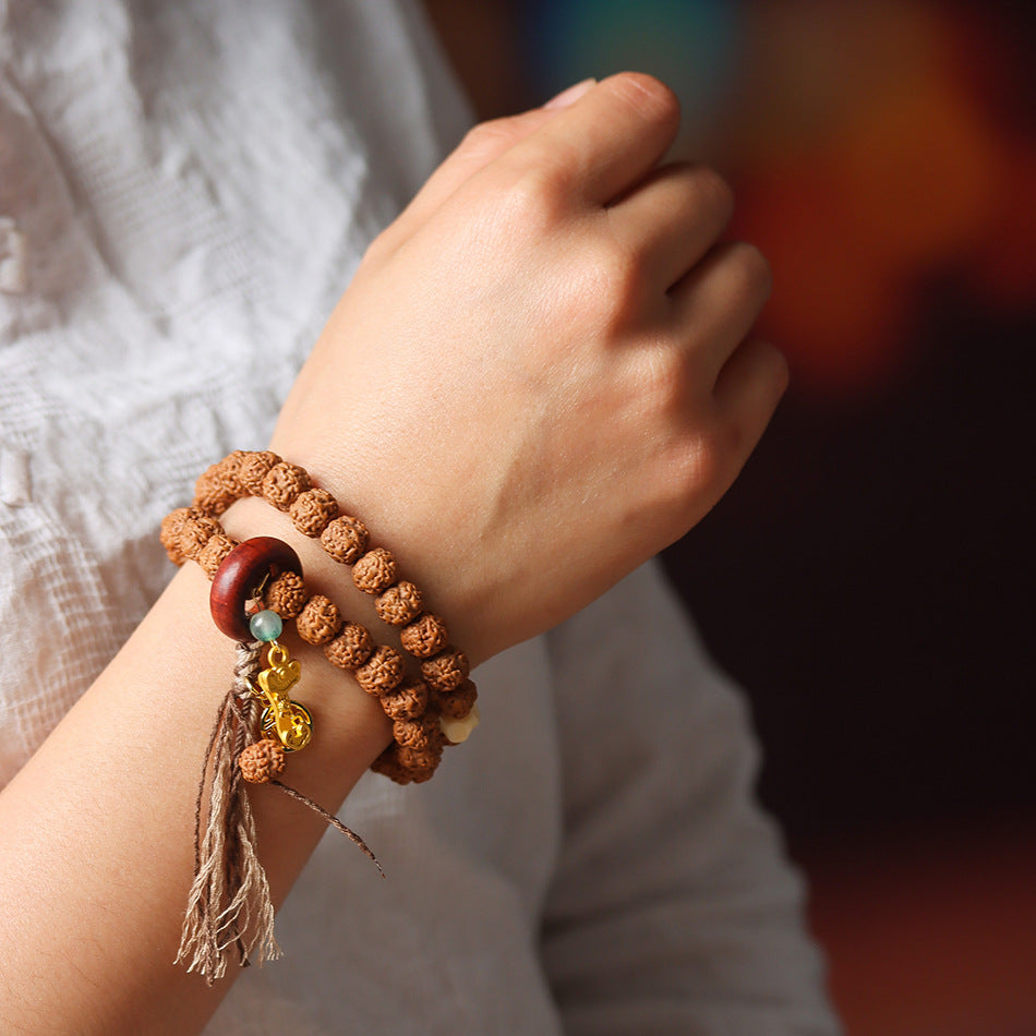 Double Wrap Rudraksha Bracelet with Sandalwood Ring and Gold Ruyi Charm