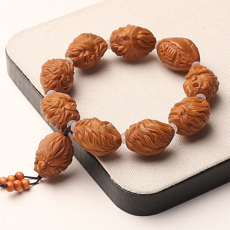 Hand-Carved Olive Pit Bracelet Featuring Sun Wukong Design