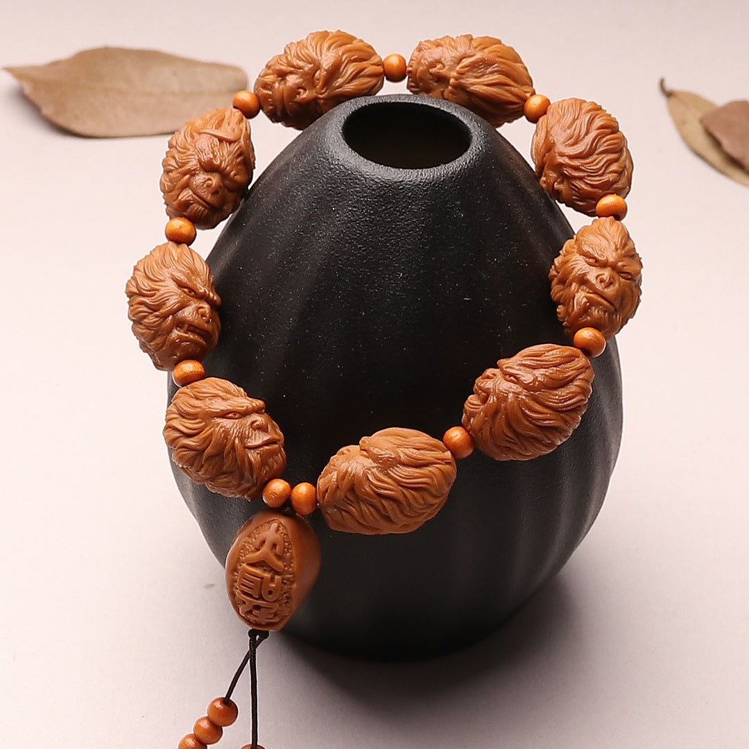 Premium Hand-Carved Olive Pit Bracelet Showcasing Legendary Sun Wukong Design