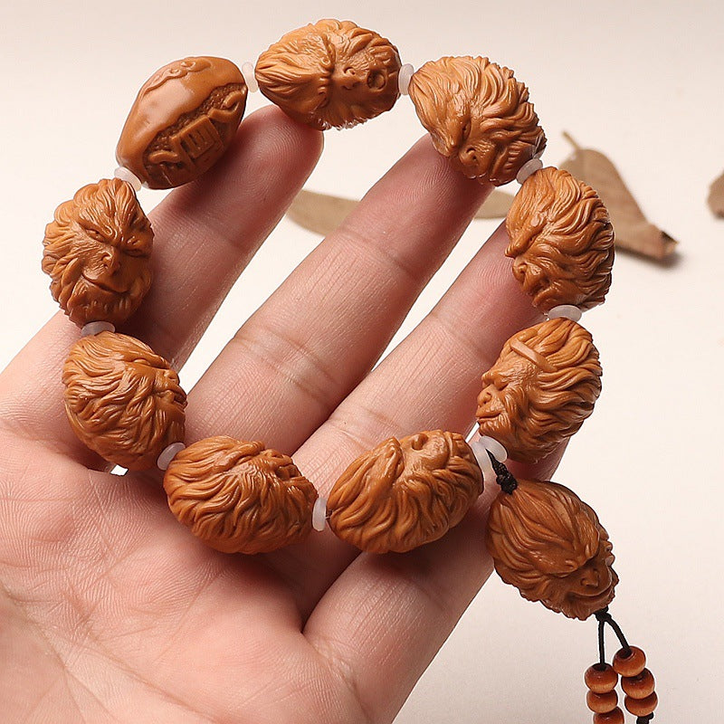 Hand-Carved Olive Pit Bracelet Featuring Sun Wukong Design