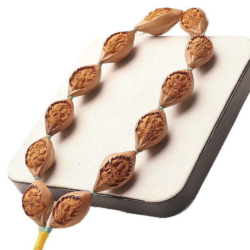 Hand-Carved Olive Pit Chinese Zodiac & Guardian Buddha Long Bead Bracelet