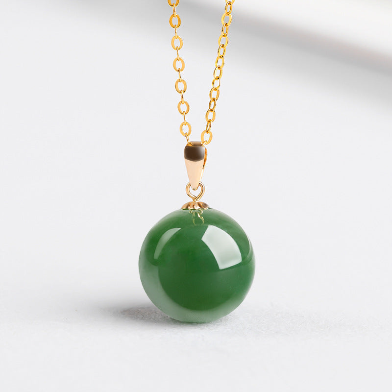 Natural Spinach Green Aged Hetian Jade Round Bead Pendant, beautifully set in 18K gold